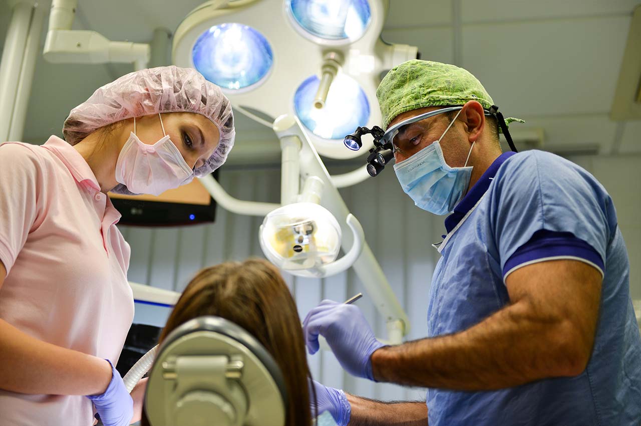 Dentist treating a patient at Perfect Smile Dental Implant Center Hungary