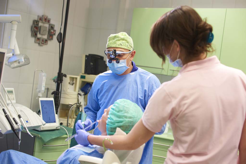 Dental team carrying out treatment at Perfect Smile Dental Implant Center Hungary